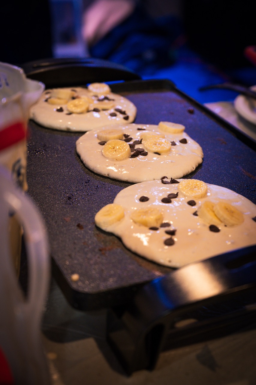 Pancakes cooking on the griddle at Pancakes & Booze